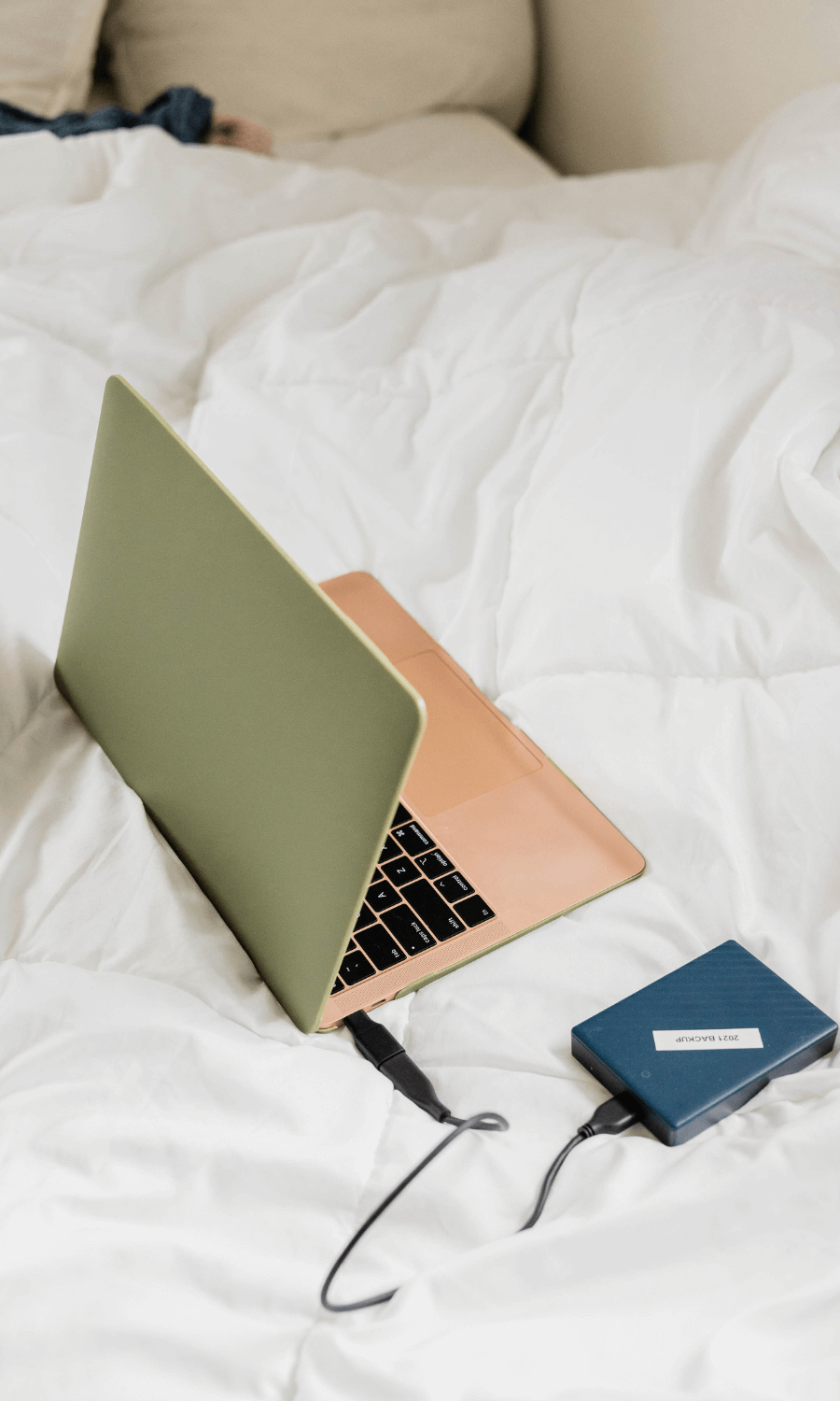 laptop open on bed for SEO service