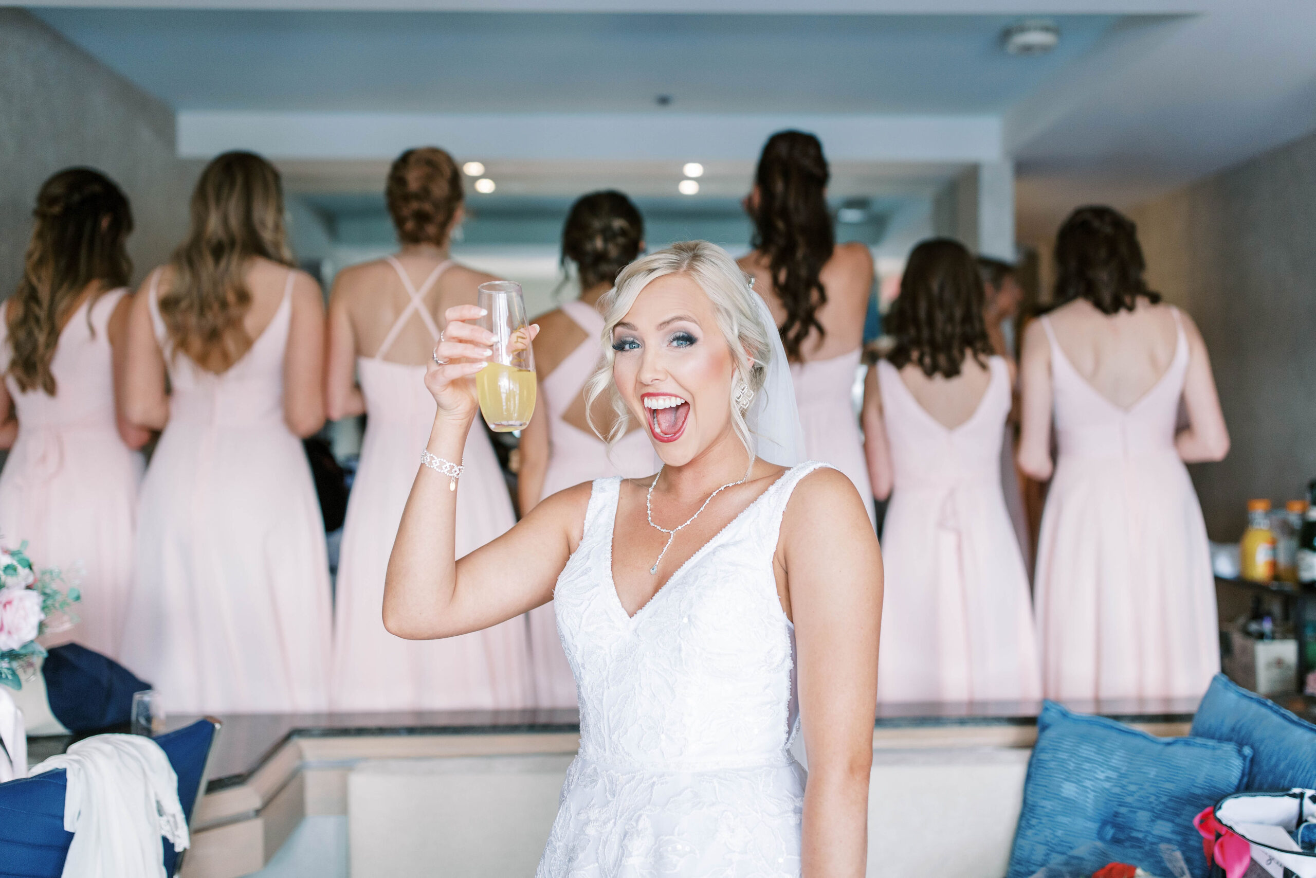 bride holding drink to show seo tips for wedding photographers