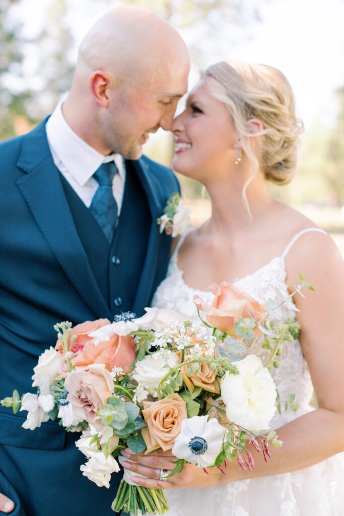 Couple at wedding with bouquet