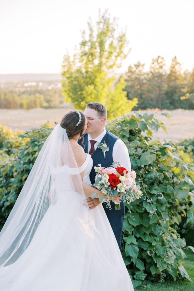 couple kissing to show keywords for wedding photographers