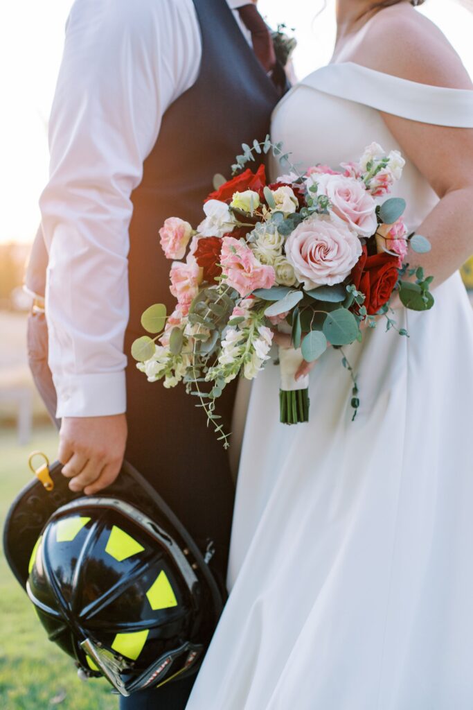 couple holding wedding flowers to show wedding photography