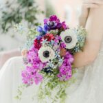 bride holding wedding bouquet to show seo for florists