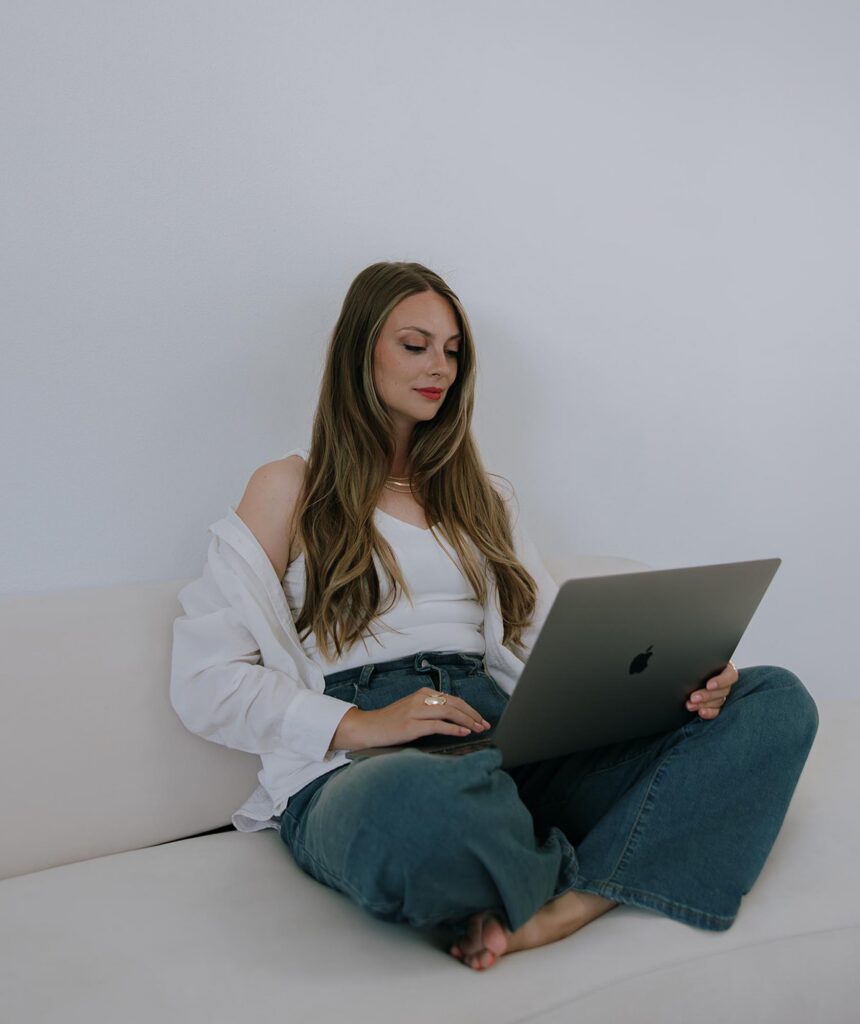 Wedding photography web designer on her laptop